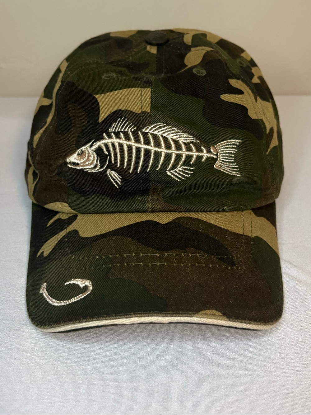 Reel Legends Camouflage Cap with White Fish Skeleton Embroidery